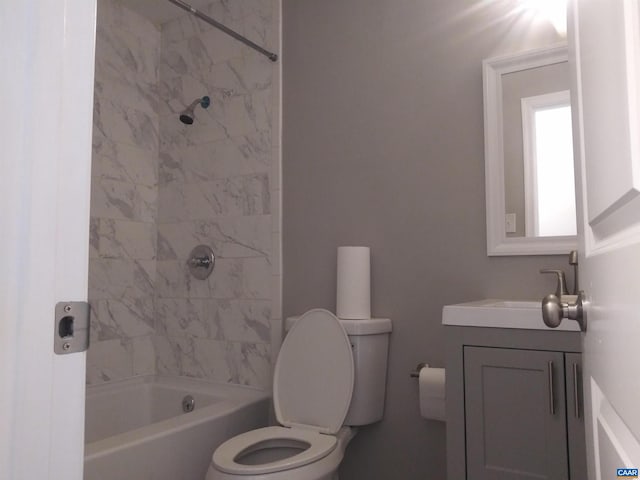 full bathroom featuring vanity, toilet, and tiled shower / bath combo