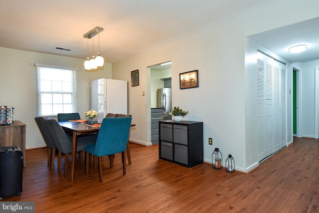 dining room featuring wood-type flooring