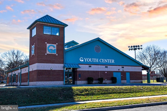 view of outdoor building at dusk