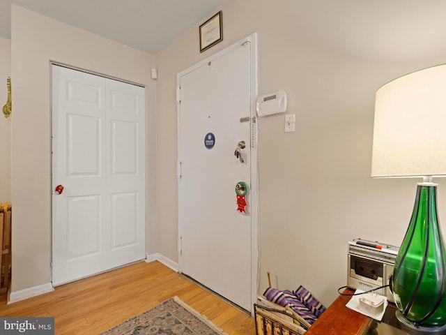 foyer with light hardwood / wood-style floors