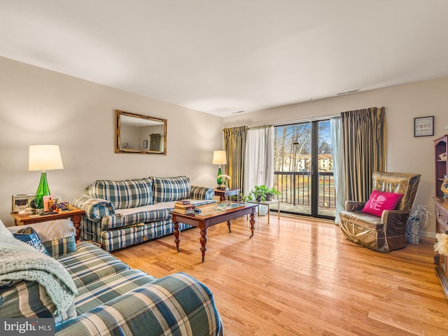 living room with light hardwood / wood-style flooring