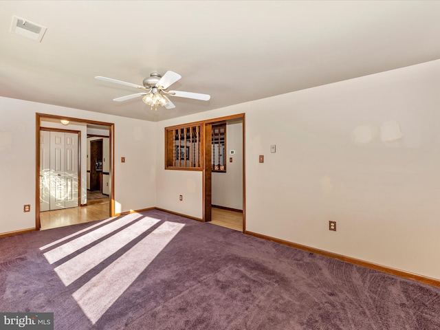 unfurnished room with light carpet and ceiling fan