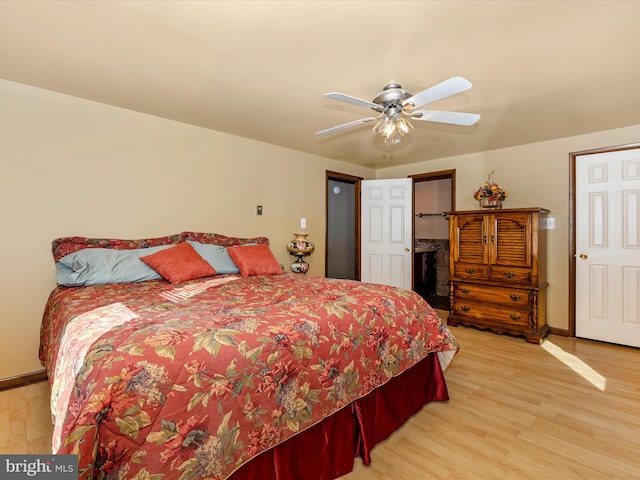 bedroom with ceiling fan and light hardwood / wood-style flooring