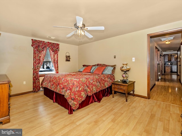 bedroom featuring light hardwood / wood-style floors and ceiling fan