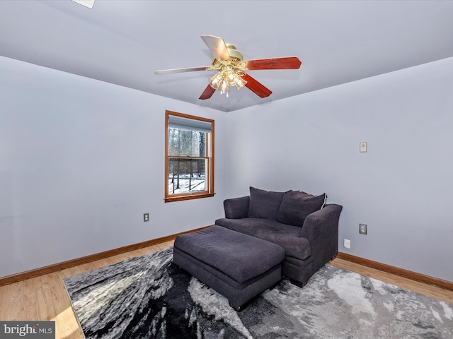 sitting room featuring hardwood / wood-style flooring and ceiling fan