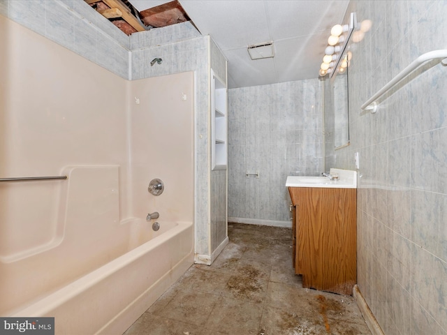 bathroom with shower / bathing tub combination and vanity