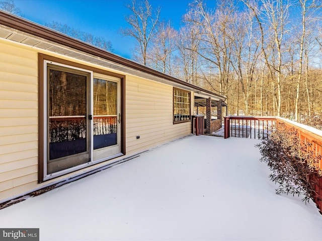 view of snow covered deck