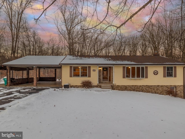 view of front of property featuring a carport