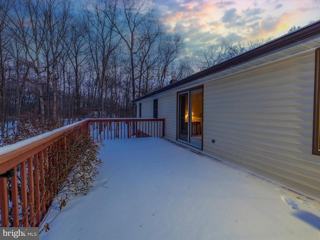 view of snow covered deck