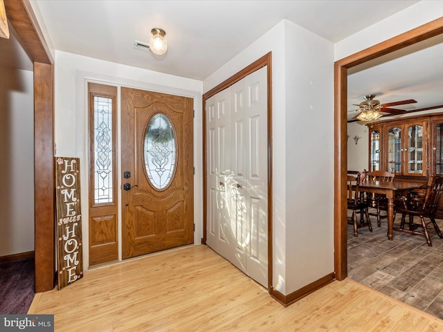 entrance foyer featuring light wood-type flooring and ceiling fan