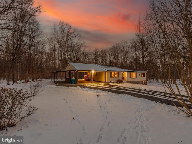 view of snow covered house