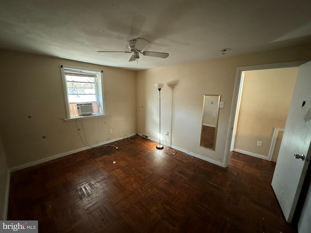 unfurnished bedroom with dark parquet flooring, ceiling fan, and cooling unit