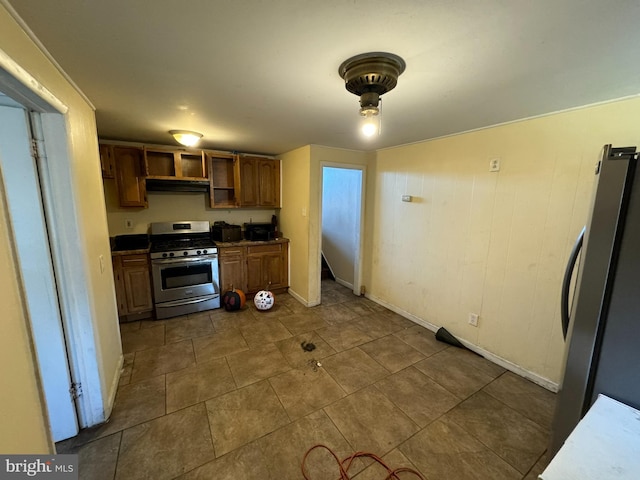 kitchen with stainless steel appliances and range hood