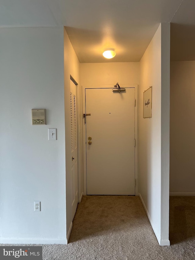 corridor featuring carpet flooring