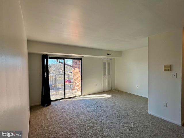 empty room with light colored carpet