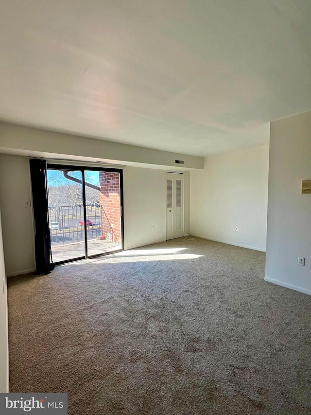 empty room featuring carpet floors