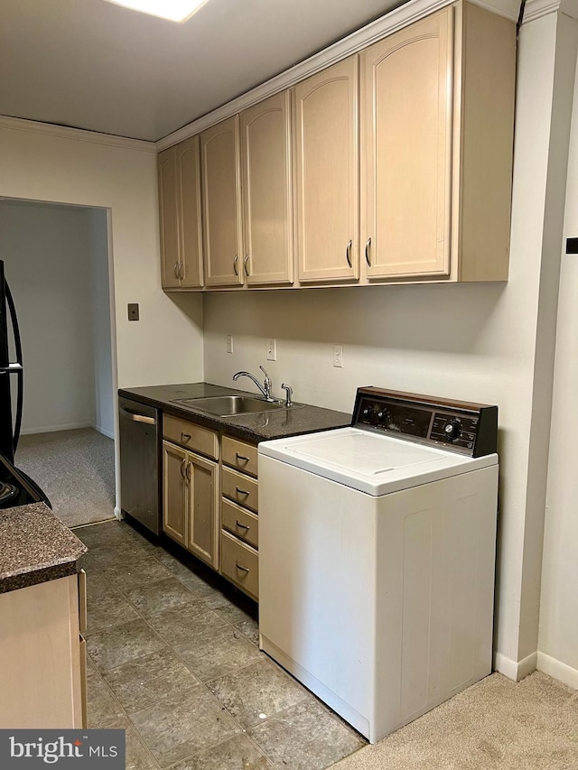 laundry area with washer / clothes dryer, sink, and cabinets