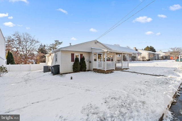 ranch-style house featuring cooling unit and covered porch