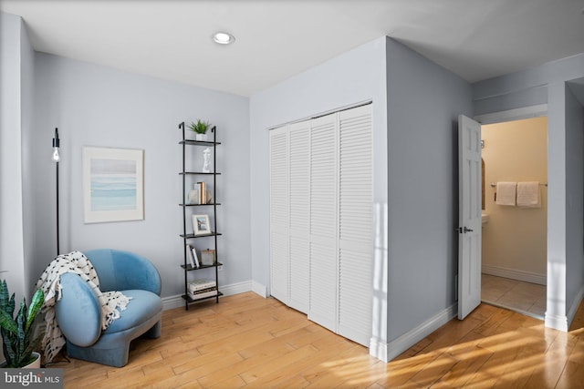 sitting room with light hardwood / wood-style flooring