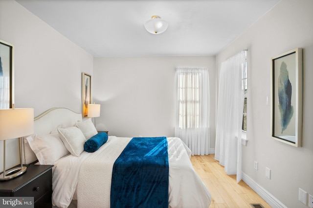 bedroom with light wood-type flooring