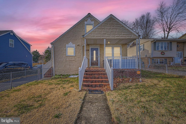 bungalow with a lawn and a porch