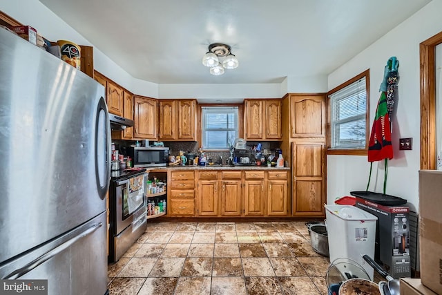 kitchen featuring tasteful backsplash, sink, and stainless steel appliances