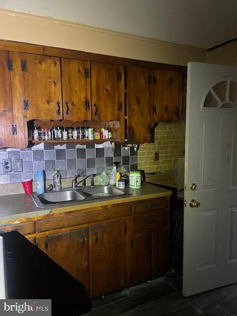 kitchen with sink and tasteful backsplash