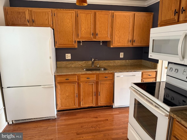 kitchen with white appliances, light hardwood / wood-style floors, sink, stone countertops, and crown molding