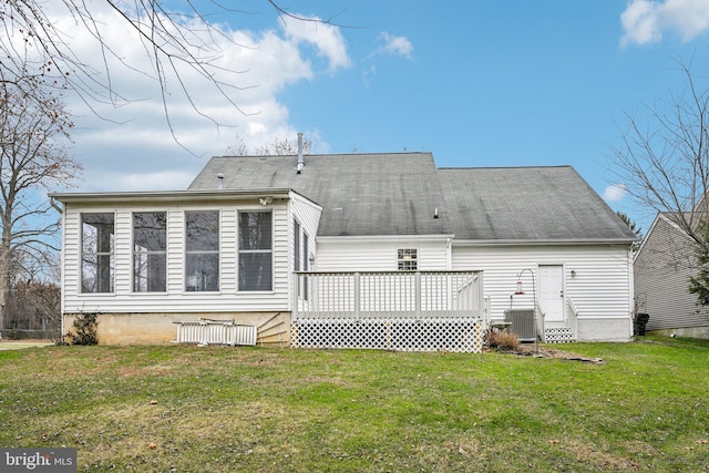 back of house featuring a yard, a deck, and central air condition unit