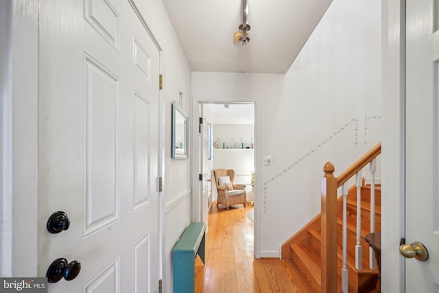 foyer entrance with light hardwood / wood-style floors