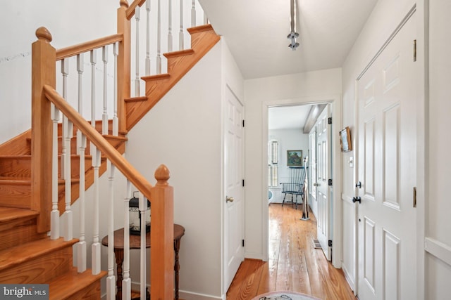 stairs with wood-type flooring