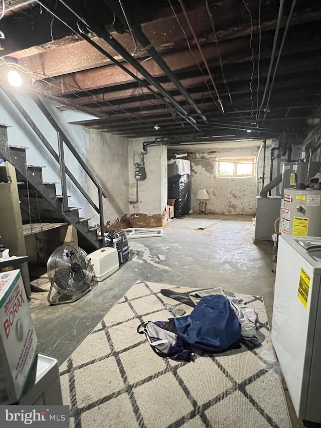 basement with washer / clothes dryer and gas water heater