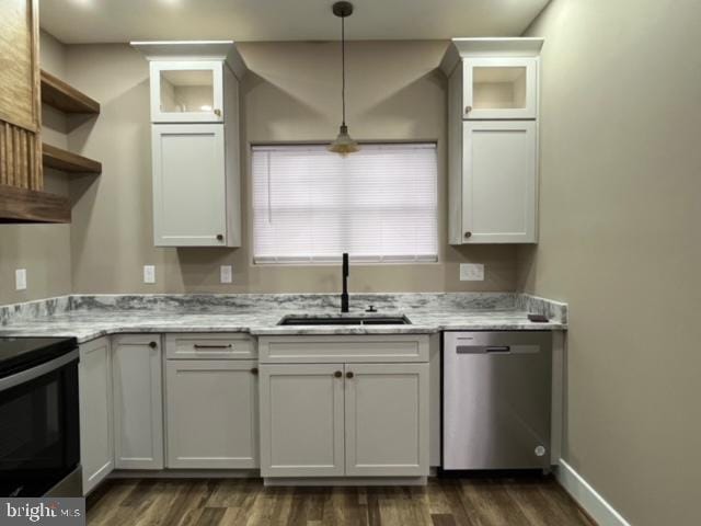 kitchen featuring white cabinetry, stainless steel dishwasher, and sink