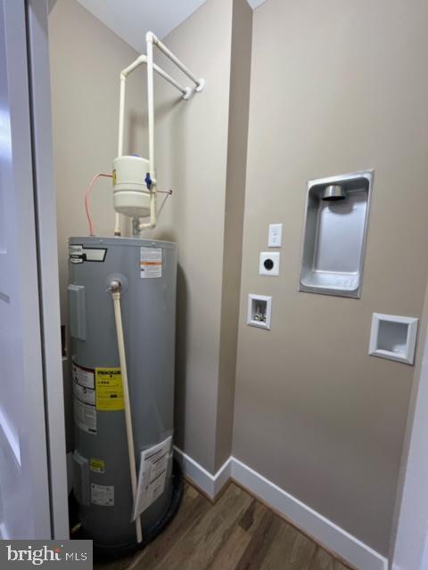 utility room featuring electric water heater