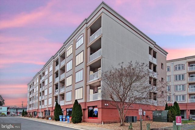 outdoor building at dusk featuring central AC