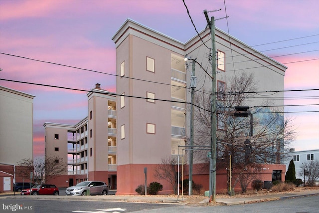 view of outdoor building at dusk