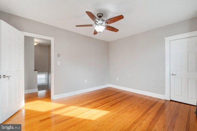 unfurnished bedroom with hardwood / wood-style floors and ceiling fan