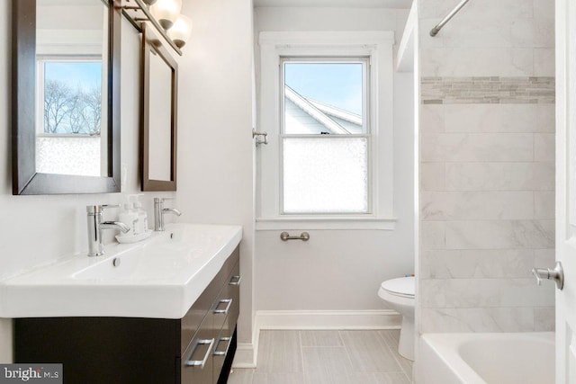 full bathroom featuring tile patterned floors, vanity, toilet, and tiled shower / bath