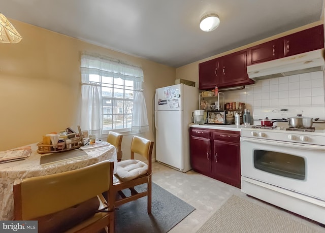 kitchen with decorative backsplash and white appliances