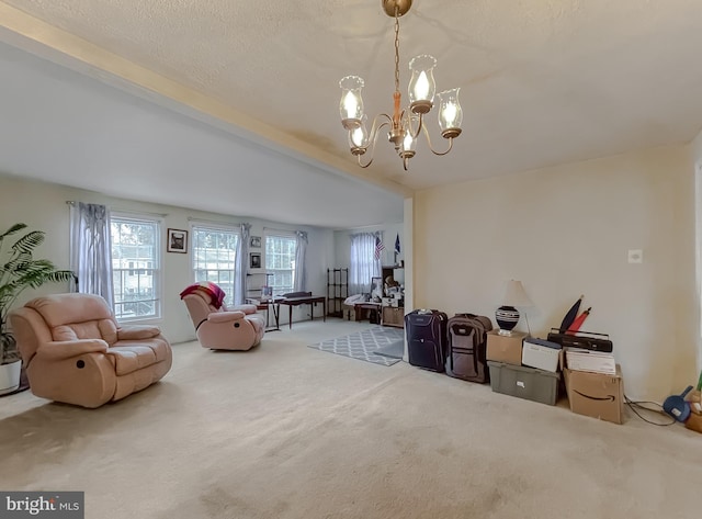 interior space featuring a chandelier, beam ceiling, carpet flooring, and a textured ceiling