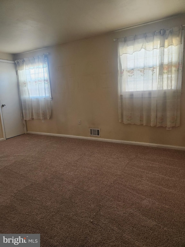 empty room featuring carpet floors