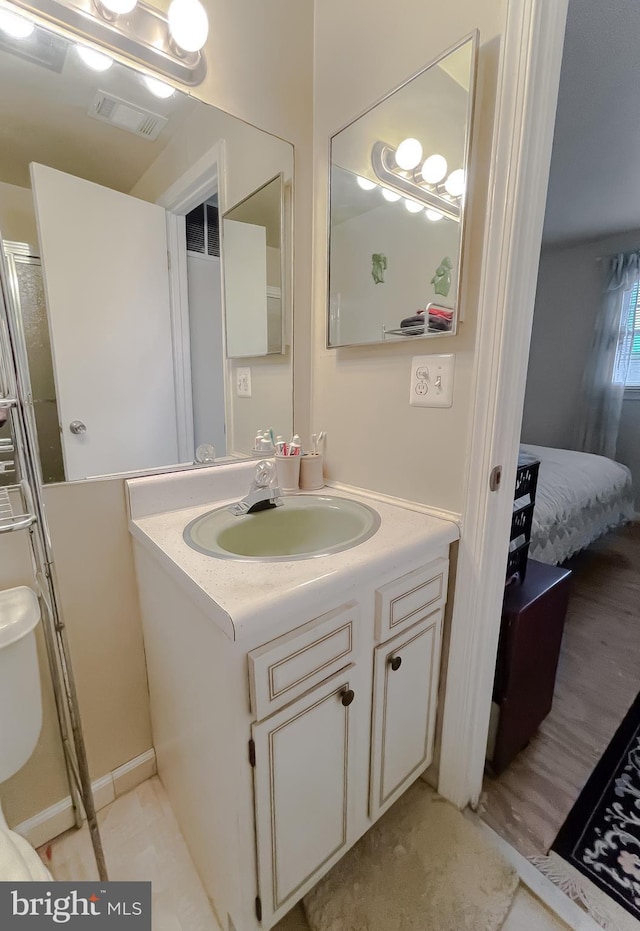 bathroom with vanity and toilet