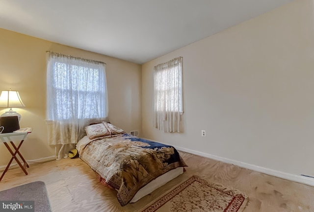 bedroom featuring light wood-type flooring