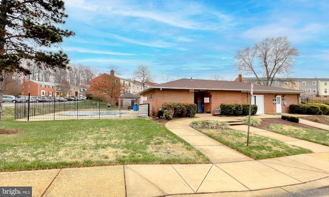 exterior space featuring a pool and a front lawn