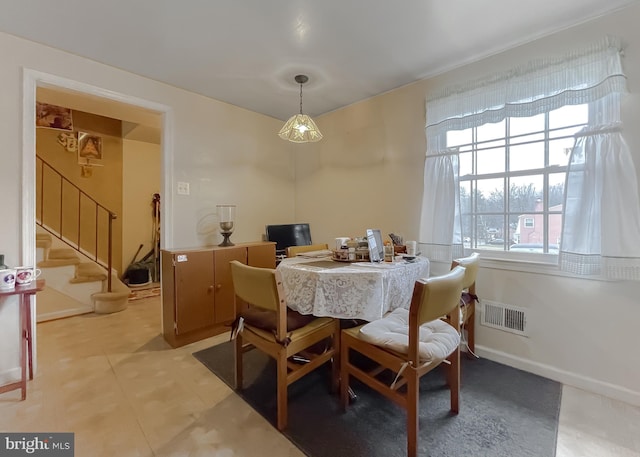 dining area featuring a healthy amount of sunlight and light tile patterned floors