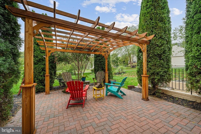 view of patio / terrace with a pergola and an outdoor fire pit