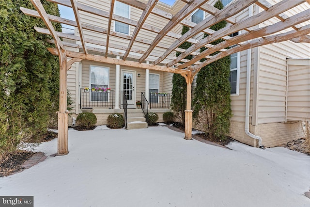 doorway to property with a pergola