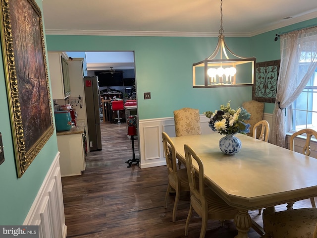 dining area with crown molding and dark wood-type flooring