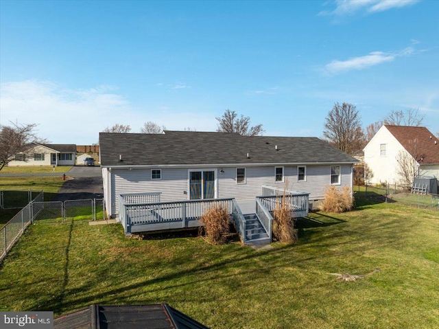 back of house with a yard and a wooden deck