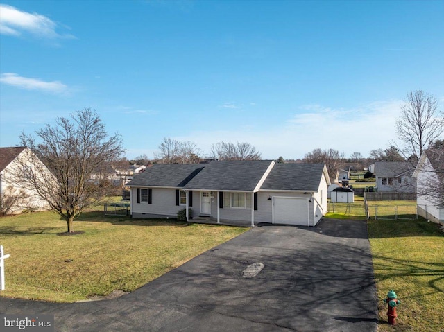 ranch-style home with a front yard and a garage